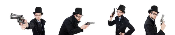 Junger Detektiv in schwarzem Mantel mit Handfeuerwaffe auf weißem Untergrund — Stockfoto