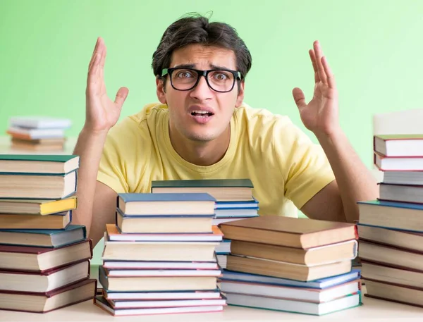 Student with too many books to read before exam — Stock Photo, Image