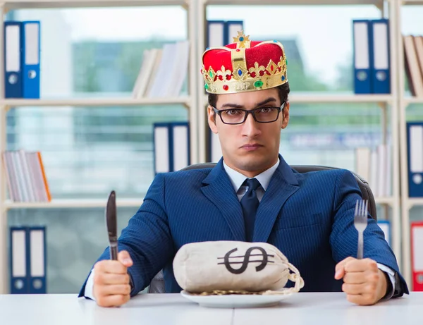 stock image King businessman with money sack in office