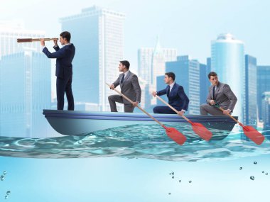 Tekneyle takım çalışması yapan iş adamları.