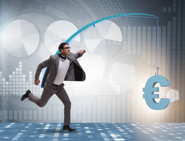 Businessman chasing money on fishing rod — Stock Photo, Image