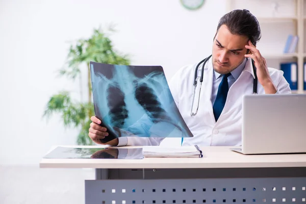 Young male handsome doctor working in the clinic — Stock Photo, Image