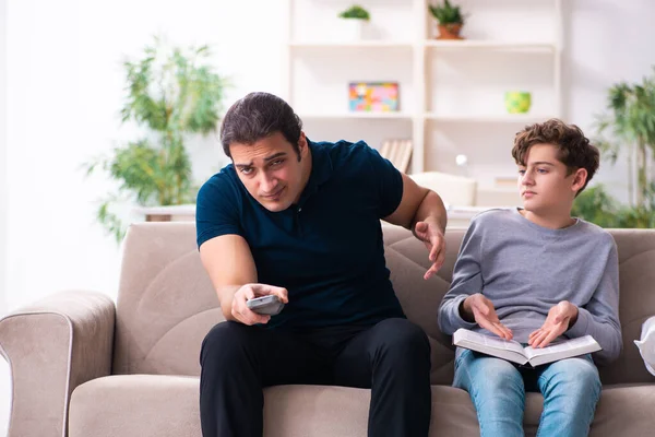 Father and son in exam preparation concept