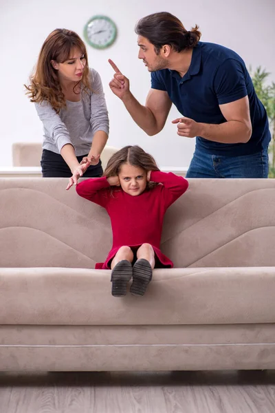 Young couple and their daughter in family conflict concept — Stock Photo, Image