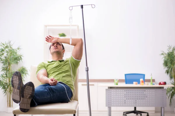 Young male patient in blood transfusion concept — Stock Photo, Image