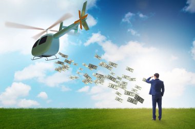 İş adamıyla helikopter para konsepti