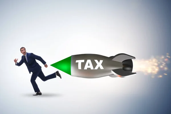 Concept of tax with businessman chased by rocket — Stock Photo, Image