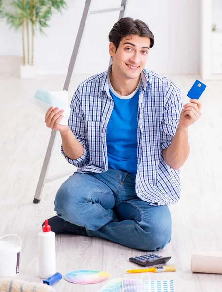 Young man overspending his budget in refurbishment project — Stock Photo, Image