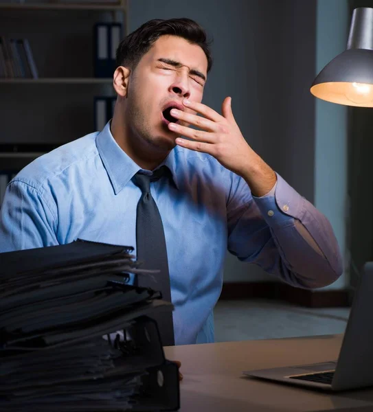 Employee working late at night at important report — Stock Photo, Image