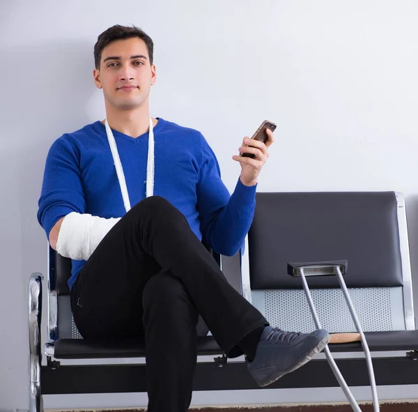 Desperate man waiting for his appointment in hospital with broke