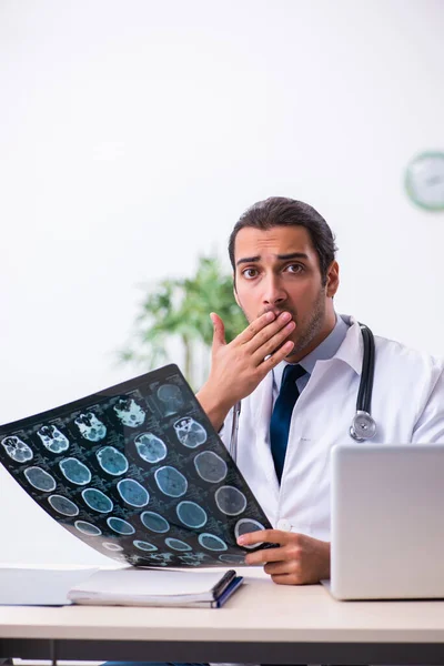 Young male handsome doctor working in the clinic — Stock Photo, Image