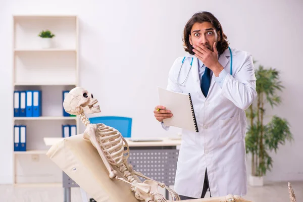 Crazy doctor examining dead patient