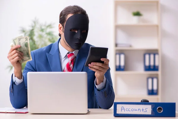 Male employee with mask in hipocrisy concept — Stock Photo, Image