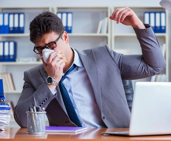 Businessman sweating excessively smelling bad in office at workp