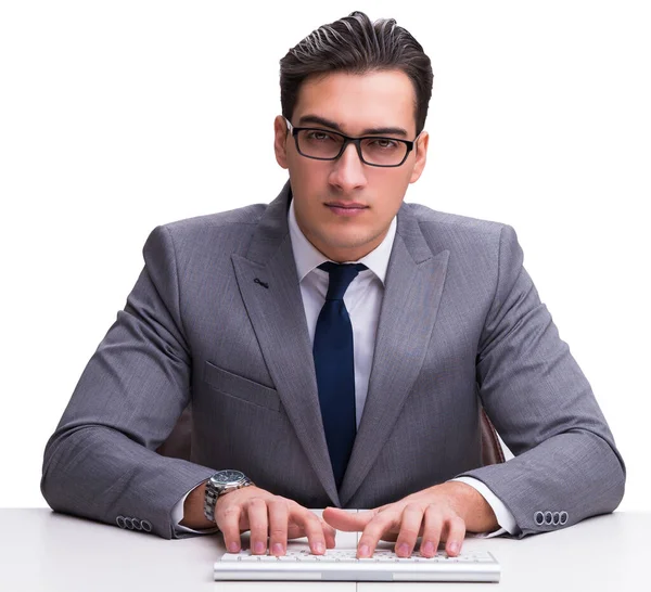 Joven hombre de negocios escribiendo en un teclado aislado en backgro blanco — Foto de Stock