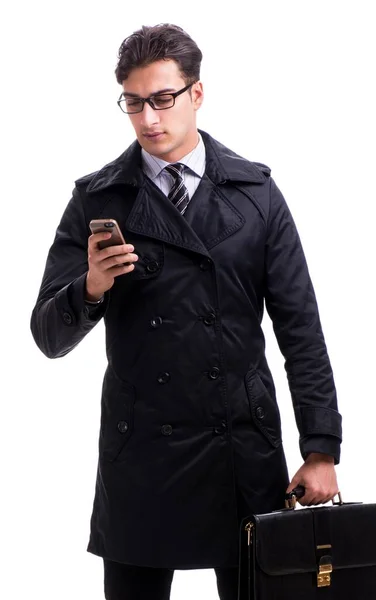 O jovem homem de negócios usando casaco de inverno isolado em branco — Fotografia de Stock