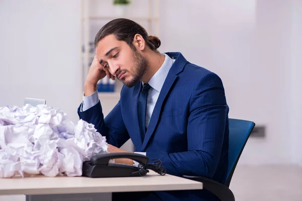 Businessman rejecting new ideas with lots of papers — Stock Photo, Image