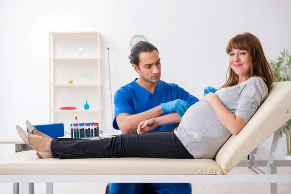 Young pregnant woman in blood transfusion concept — Stock Photo, Image
