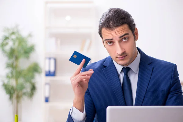 Young male logistics specialist working in the office — Stock Photo, Image