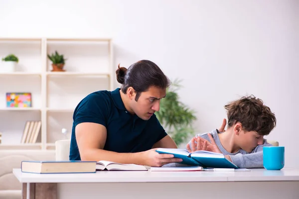 Father and son in exam preparation concept