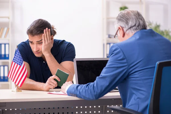 Young man visiting embassy for visa application — Stock Photo, Image