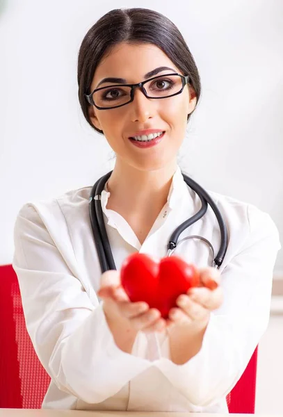 Young doctor in heart care concept — Stock Photo, Image