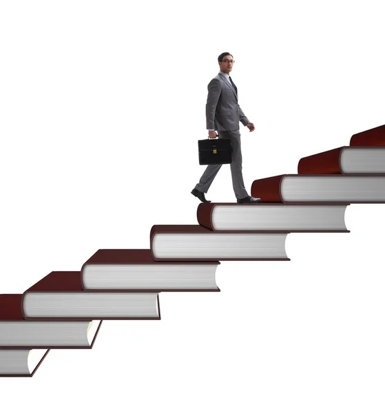 Businessman student climbing the ladder of education books — Stock Photo, Image