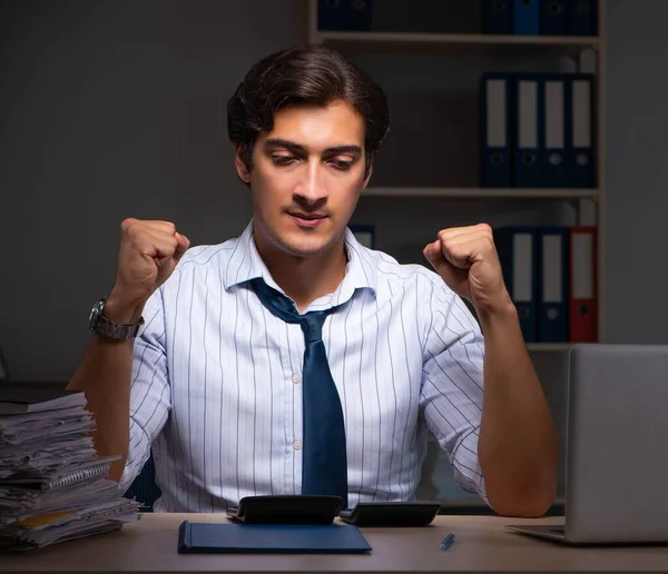 Young financial manager working late at night in office — Stock Photo, Image