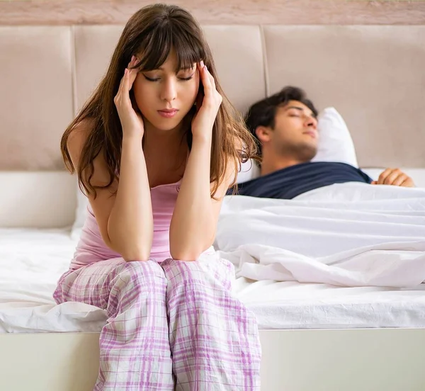 Woman and man in the bedroom after conflict — Stock Photo, Image