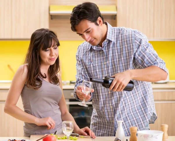 Young couple celebrating wedding anniversary at kitchen — Stock Photo, Image