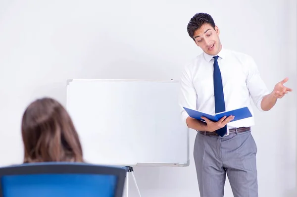 Business presentation in the office with man and woman — Stock Photo, Image