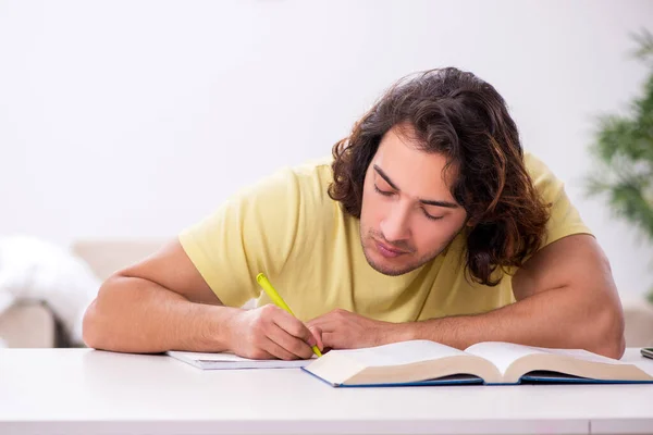 Young male student preparing for exams at home Royalty Free Stock Photos