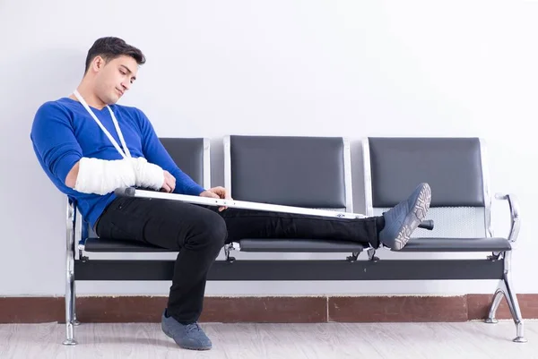 Desperate man waiting for his appointment in hospital with broke