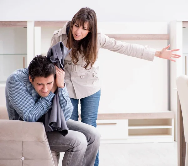 Young couple disappointed with price in furniture store — Stock Photo, Image