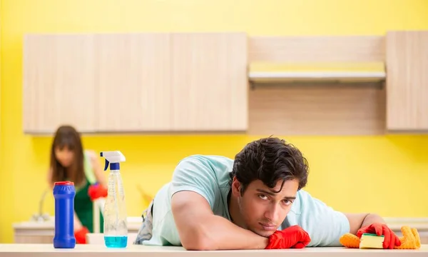 Young couple working at kitchen — Stock Photo, Image