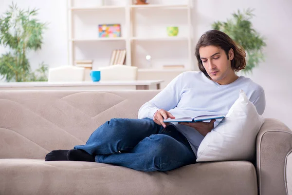 Young male student preparing for exams at home — Stock Photo, Image