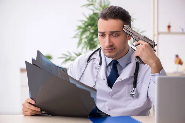 Young male doctor working in the clinic — Stock Photo, Image