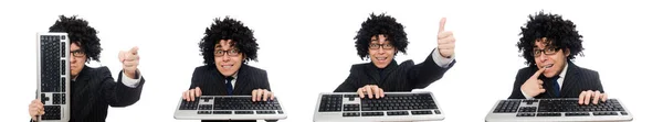 Jonge werknemer met toetsenbord geïsoleerd op wit — Stockfoto