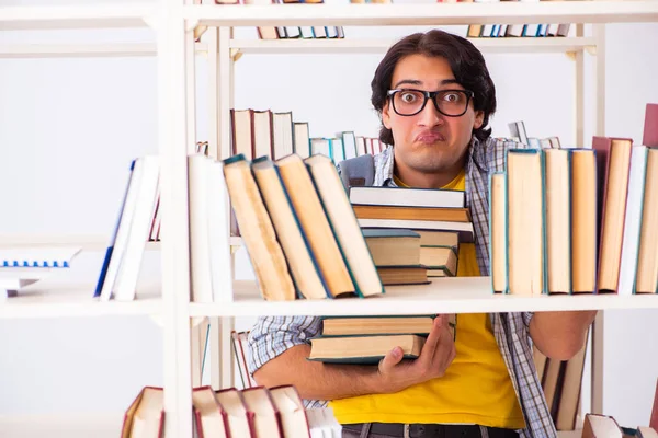 Male student preparing for exams at library — Stock Photo, Image