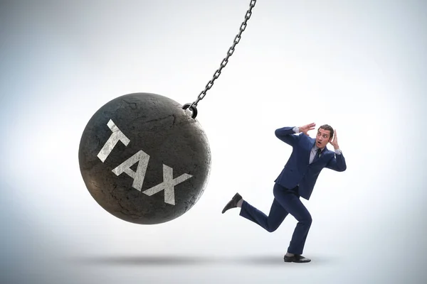 Businessman running away from high taxes — Stock Photo, Image