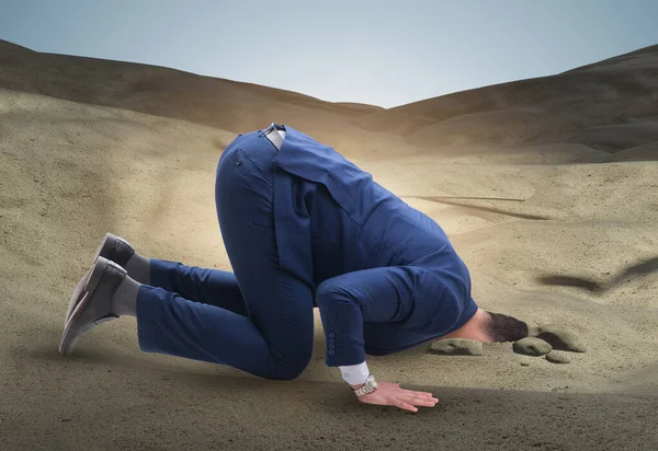 Businessman hiding his head in sand escaping from problems — Stock Photo, Image