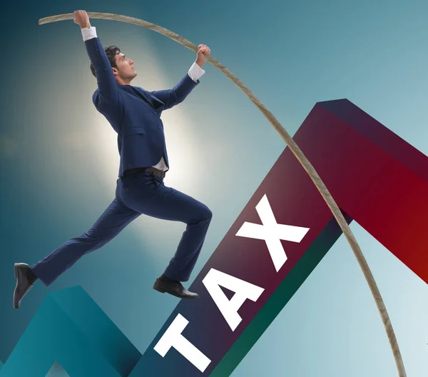 Businessman jumping over tax in tax evasion avoidance concept — Stock Photo, Image