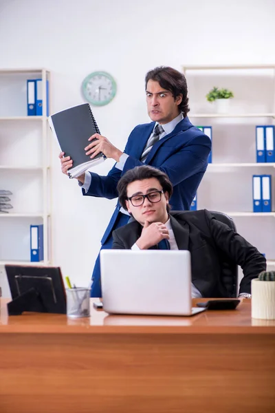 Boss and his male assistant working in the office — Stock Photo, Image