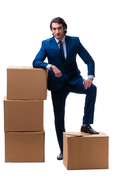 Junger männlicher Angestellter mit Schachteln auf weißem Grund — Stockfoto