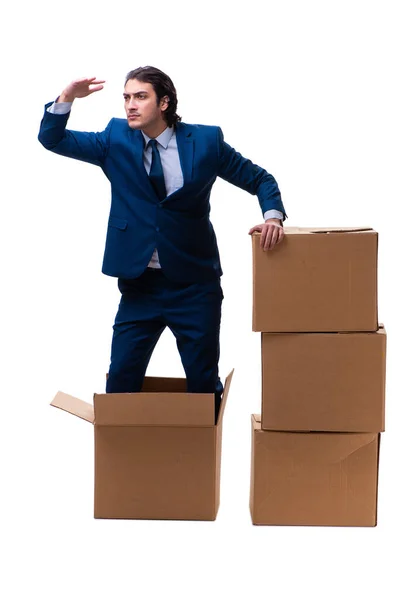 Jovem funcionário masculino com caixas isoladas em branco — Fotografia de Stock
