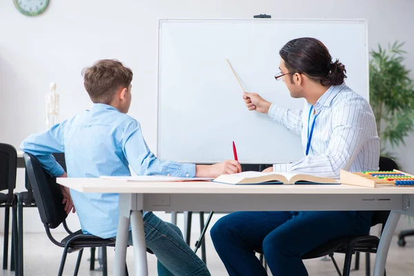 Young father helping his son to prepare for exam — Stock Photo, Image