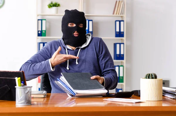 Male thief in balaclava in the office — Stock Photo, Image