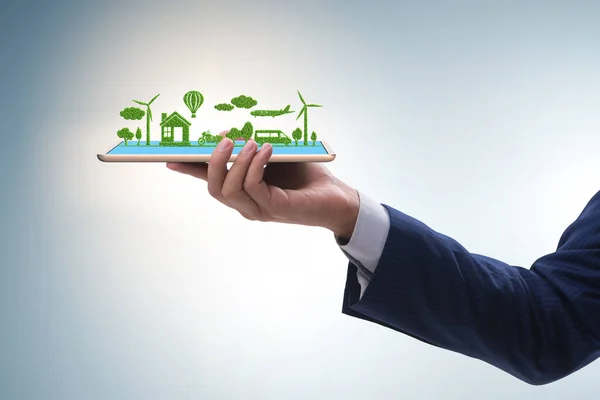 Hand holding tablet with mini ecosystem and clean energy — Stock Photo, Image