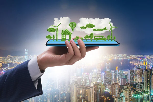 Hand holding tablet with mini ecosystem and clean energy — Stock Photo, Image