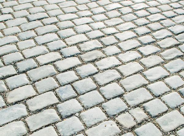 Estrada pavimentada com pedras de calhau para o seu fundo — Fotografia de Stock